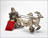 Santa
rides a cast-iron sleigh made in the United States