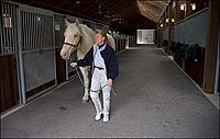 In Colonial Williamsburg's stables, Karen Smith and Mary, here about four years old and a heft heavier than she was in the previous image.