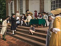 Election day brings, from left, Colonial Williamsburg interpreters Dan Moore, Jay Howlett, Star Galloway, Barbara Tyler, Phil Shultz, Tom Hay, Jack Flintom, Lyndon Howlett, Greg James, Alex Clark, John Needre, Christine Diffel, and Hope Smith to the Courthouse steps.