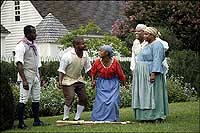 African-American interpreters reenact the Jumping the Broom wedding ceremony