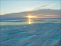 A long-wished-for northern water route from Atlantic to Pacific promised greatly shortened voyages to trade for riches from the East. The Arctic yielded no ready access till recent summer melting of the polar cap.