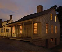 Golden light sloshes from the coffeehouse windows onto the dusky street outside.