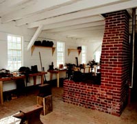 Interior of the reconstructed armory and its central forge.