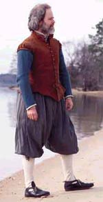 Author and shoemaker D. A. Saguto poses on the Jamestown shore wearing shoes he copied from a circa-1606 pair made in Watford, England