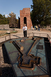 The author next to a 1/4-scale bronze model of the excavated
fort, with the tower of the 1647 church standing behind him