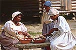 Women scaling fish