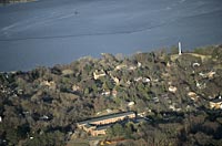 The Victory Monument, Yorktown—Cornwallis' headquarters, the large brick Nelson House at center—and the York River today.
