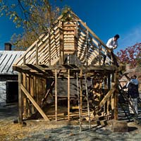 Master carpenter Garland Wood, right, works with Jack Underhill on framing one of the Anderson Armoury buildings.