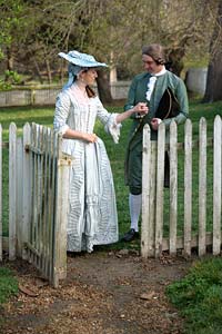 Newly betrothed, Betsy and Edmund walk hand in hand.