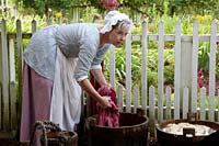 Karen Clancy rinses the dyed wool.